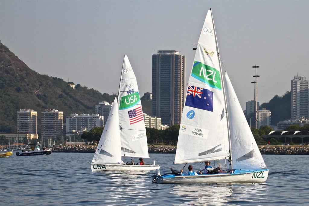 The NZL and USA crews await the arrival of the wind for the start of the Medal Race in the Womens 470. © Richard Gladwell www.photosport.co.nz